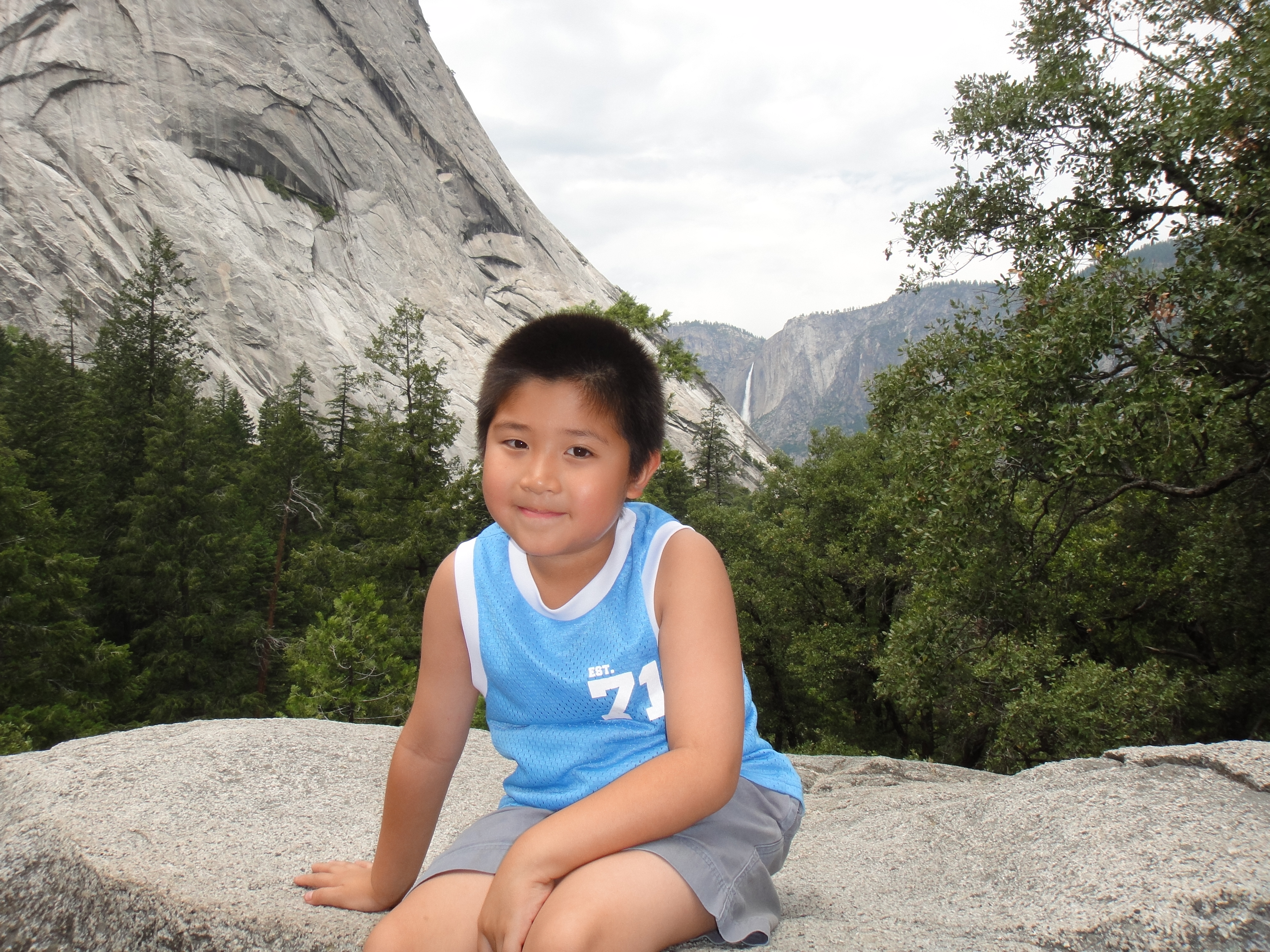 William sitting on a rock at Yosemite